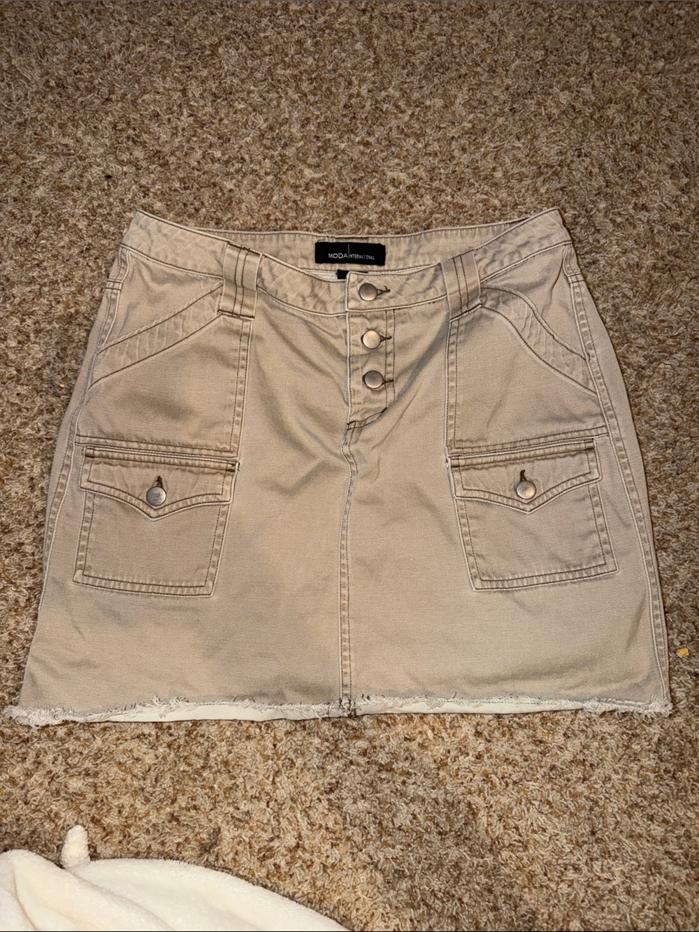 Moda International khaki skirt features a cargo-style design